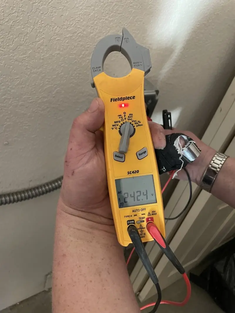 Voltage testing with clamp meter during Generator Installation in Plum